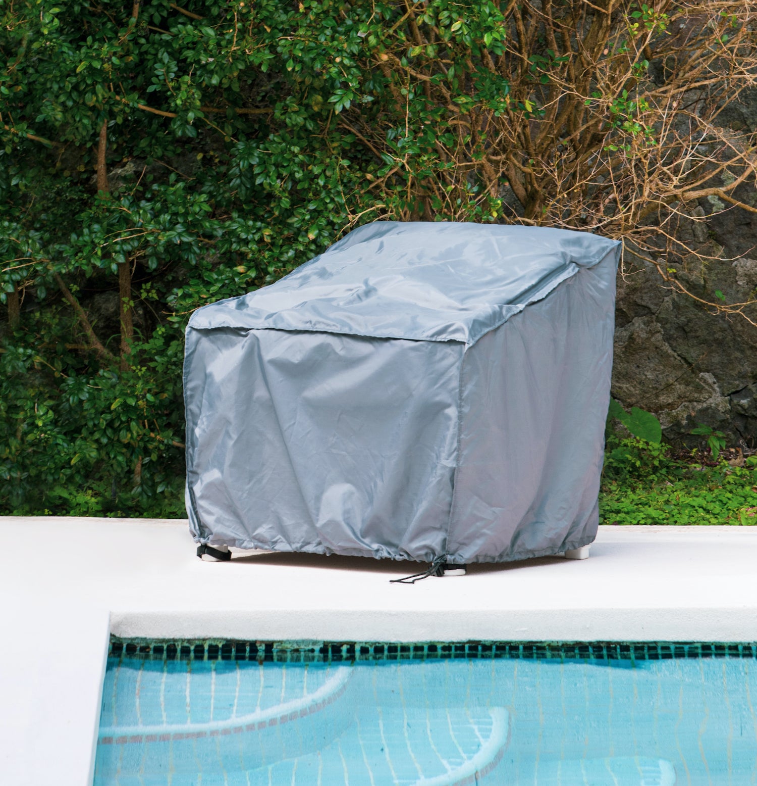 Pillow-to-Cover covering an outdoor club chair by the pool